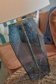 Blue glass table lamp with a sleek design from Signature Design by Ashley® for modern home décor.