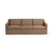 Classic Home Kipton upholstered stationary sofa with plush cushions and fabric upholstery in a stylish living room setting.