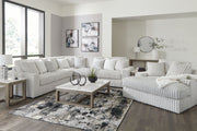 Signature Design by Ashley 5-piece living room set featuring a sofa, loveseat, and armchairs in a modern living space.