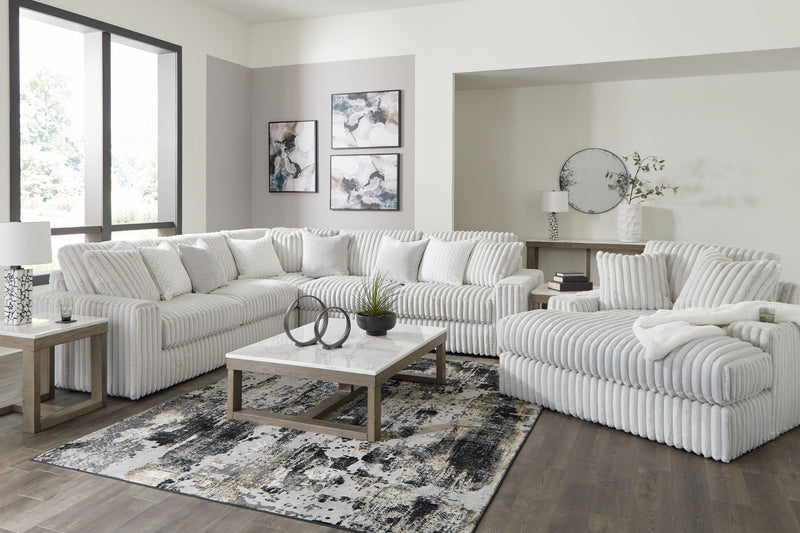 Signature Design by Ashley 5-piece living room set featuring a sofa, loveseat, and armchairs in a modern living space.