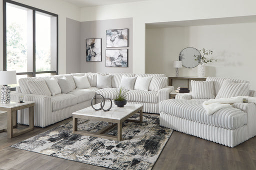 Signature Design by Ashley 5-piece living room set featuring a sofa, loveseat, and armchairs in a modern living space.