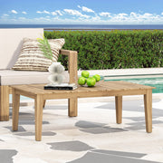 Noble House outdoor coffee table with slat panel top, light brown wood finish, sturdy design perfect for patio or garden spaces.