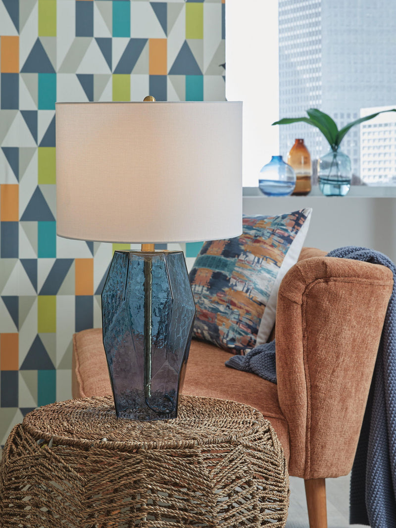 Blue glass table lamp from Signature Design by Ashley® featuring a modern design and sleek base, perfect for contemporary decor.