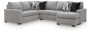 Benchcraft Lakepoint stationary sectional sofa with plush cushions and contemporary design, shown in a modern living room setting.