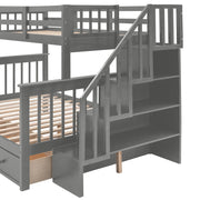 DreamHaus stairway bunk bed with built-in storage drawers and safety guard rail in a bedroom setting.