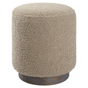 Uttermost Avila accent ottoman with plush fabric and wooden legs, versatile piece for living room or bedroom decor.
