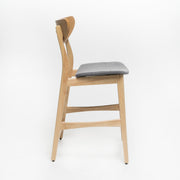Noble House retro modern counter height stool set with cushioned seats, featuring sleek wooden legs and stylish design.