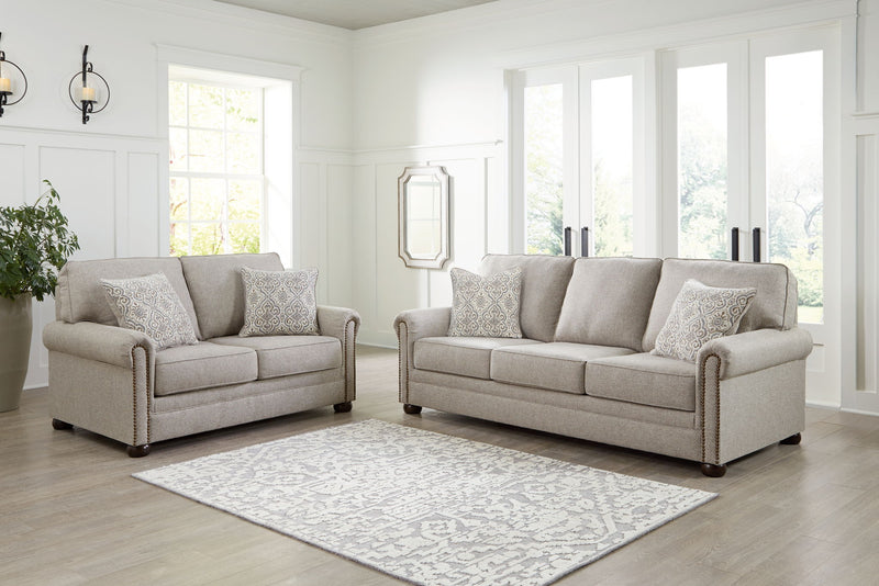 Signature Design by Ashley Gaelon living room set with stationary chair and ottoman, featuring plush upholstery and modern design.