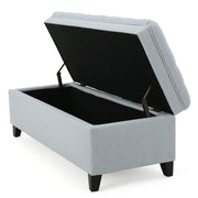 Noble House Juliana storage ottoman with birch wooden legs, beige fabric upholstery, and ample storage space.