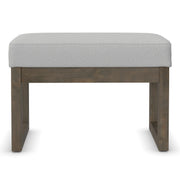 Simpli-Home Milltown upholstered ottoman bench with soft fabric upholstery and wooden legs, ideal for living room seating or footrest.