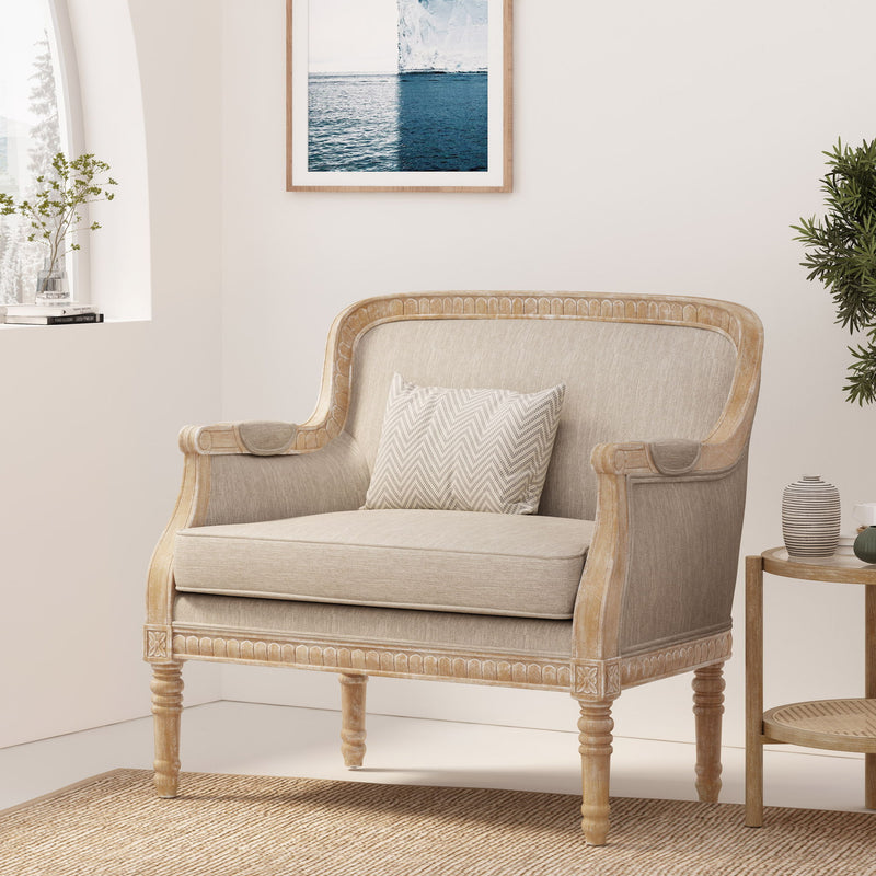 Noble House Style Club Chair with plush upholstery and wooden legs, showcasing a stylish armchair design.