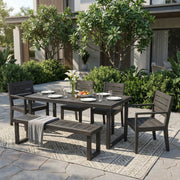 Dark gray and light gray Noble House 6-piece outdoor dining set with table, six chairs, and a bench for outdoor seating.