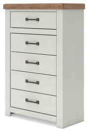 Benchcraft® Savonport five-drawer accent chest in white and brown with sleek handles and a modern design.