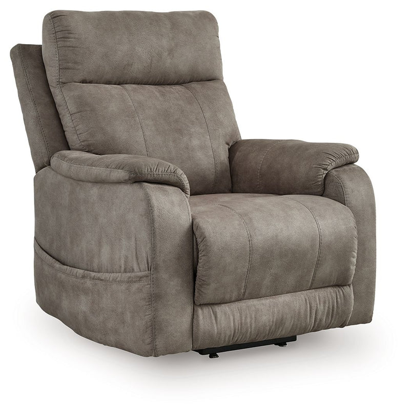 Signature Design by Ashley Crestmeade Power Lift Recliner in plush fabric with padded armrests and a reclining mechanism.