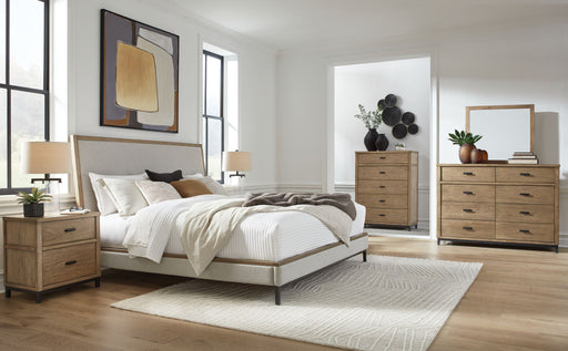 Benchcraft® Tomtyn upholstered 5-piece bedroom set with a bed, nightstands, and matching decor in a cozy, stylish bedroom scene.