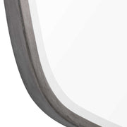 Uttermost Duronia iron wall mirror with a sleek, modern frame, hanging on a neutral-colored wall.