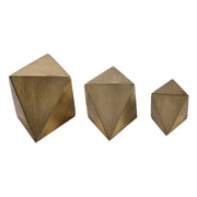 Set of three Uttermost Rhombus accents sculptures in champagne finish, modern geometric decorative figurines on display.