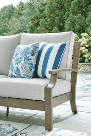 Brown and beige Rainier Ranch sofa with cushions by Signature Design Ashley®, featuring plush upholstery and a modern design.