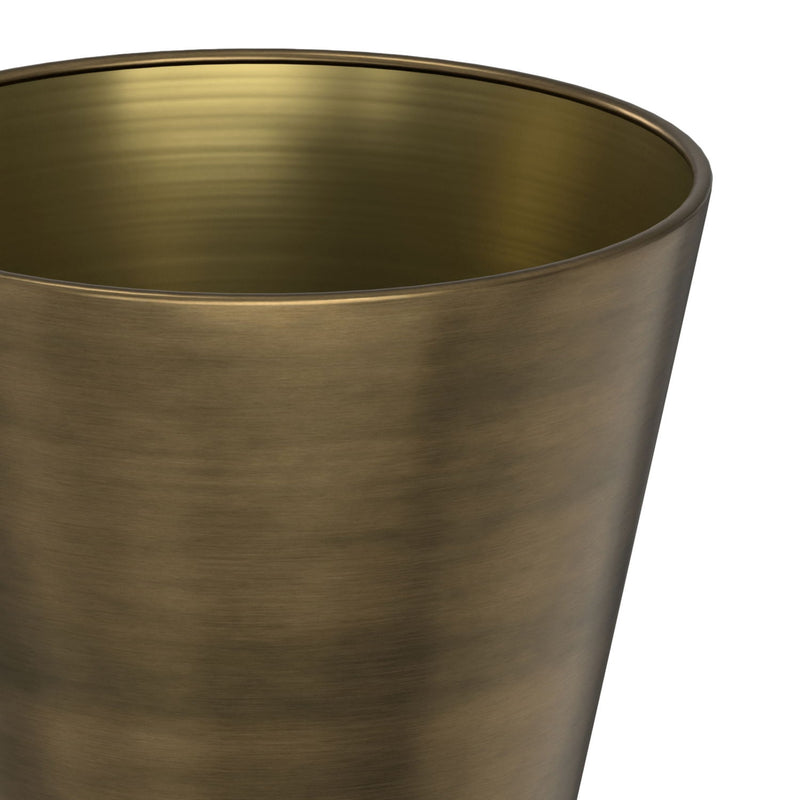 Leyla side table by Simpli-Home with antique brass finish, featuring a sleek round top and modern metal base.