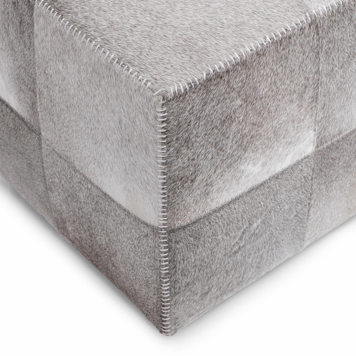 Square upholstered ottoman in Sparrow Gray from Classic Home's Landyn collection, featuring soft fabric and modern design.
