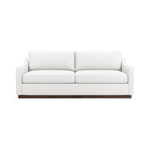 Classic Home Aspen stationary sofa with plush fabric, rolled arms, and cushioned seat in a cozy living room setting.