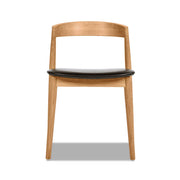Raven - Stacking Sculpted Oak Dining Chair - Warm Natural Brown / Black - R&R Furniture Gallery (Fountain Valley, CA)