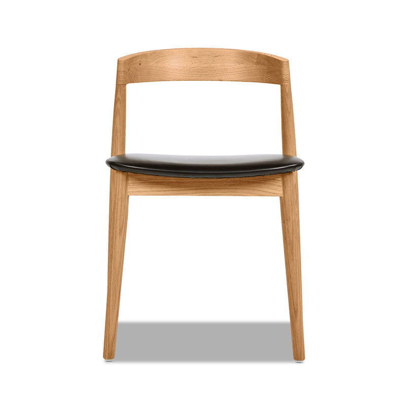 Raven - Stacking Sculpted Oak Dining Chair - Warm Natural Brown / Black - R&R Furniture Gallery (Fountain Valley, CA)