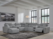 Modmax II reclining sectional in salt and pepper fabric by Signature Design by Ashley, showing plush cushions and reclining features.