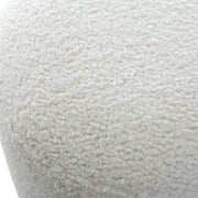 Uttermost Avila accent ottoman with tufted fabric upholstery and wooden legs, versatile for living room or bedroom decor.