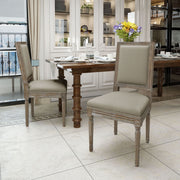 Set of traditional style Noble House dining chairs with fabric upholstery, featuring wooden legs and classic design.