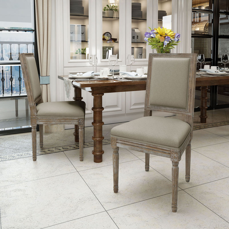 Set of traditional style Noble House dining chairs with fabric upholstery, featuring wooden legs and classic design.