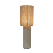 TOV Furniture Mondada concrete floor lamp with a modern, minimalist design and cylindrical base illuminated in a stylish setting.