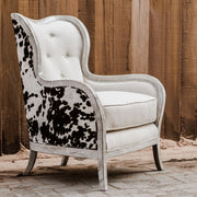 White high-back armchair from Uttermost Chalina collection featuring plush upholstery and stylish design.