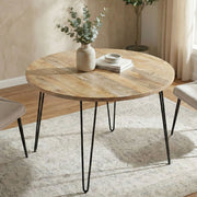 Hunter round dining table by Simpli-Home with natural wood finish, showcasing smooth, circular tabletop and sturdy base.