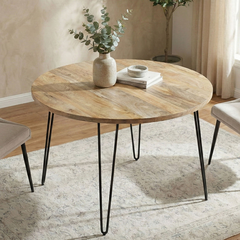 Hunter round dining table by Simpli-Home with natural wood finish, showcasing smooth, circular tabletop and sturdy base.