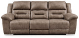 Signature Design by Ashley reclining sofa from Stoneland collection, featuring plush cushions and a comfortable reclining design.