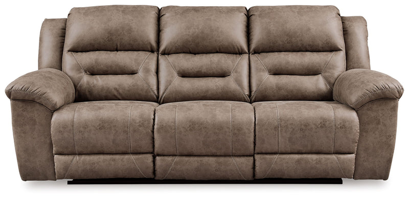 Signature Design by Ashley reclining sofa from Stoneland collection, featuring plush cushions and a comfortable reclining design.