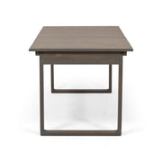 Outdoor expandable acacia wood dining table with U-shaped legs by Noble House, showing the natural wood grain and adjustable length.