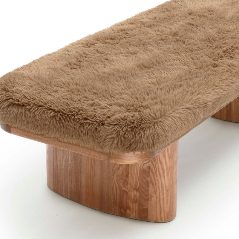 Upholstered Ollie Straight Bench by TOV Furniture featuring a sleek, modern design with plush cushioning and wooden legs.