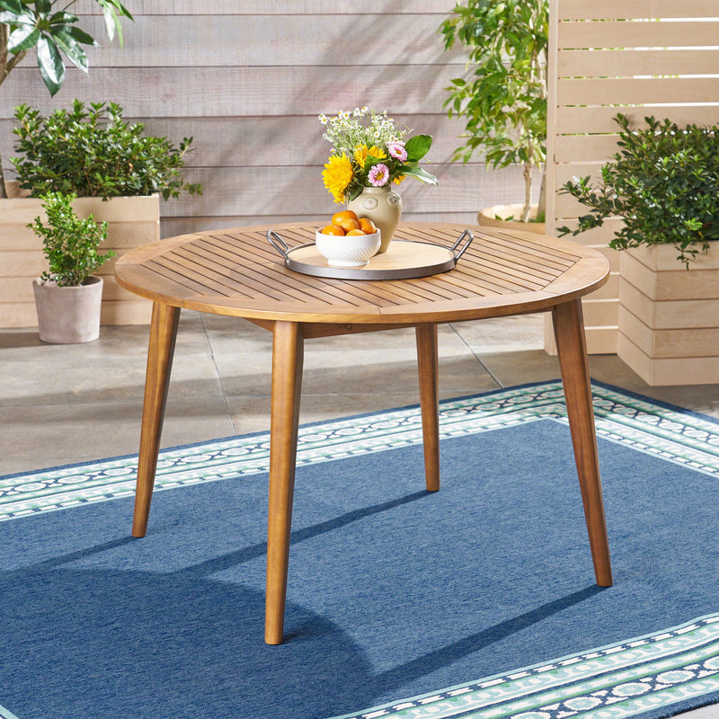 Modern Noble House Stamford outdoor dining table with sleek design and spacious surface, perfect for outdoor meals and gatherings.