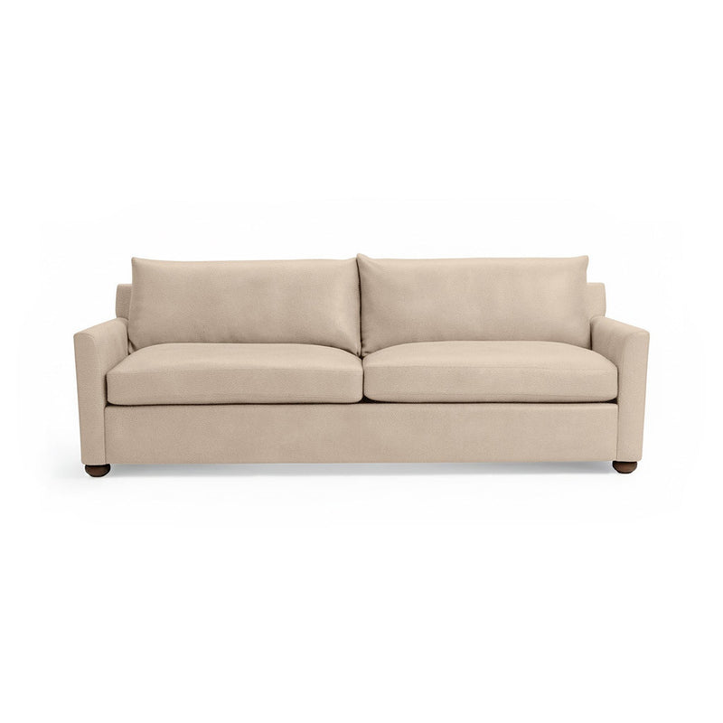 Olivia stationary sofa by Classic Home with plush fabric upholstery and modern design, shown in a cozy living room setting.