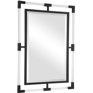 Uttermost Balkan iron wall mirror with a decorative round frame, hanging on a neutral-colored wall.