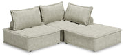 Signature Design by Ashley stationary sectional sofa with plush cushions and modern design in a spacious living room setting.