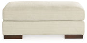 Signature Design by Ashley Maggie living room set with stationary chair and matching ottoman in cozy fabric.