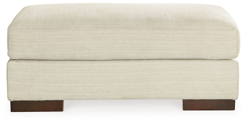 Signature Design by Ashley Maggie living room set with stationary chair and matching ottoman in cozy fabric.