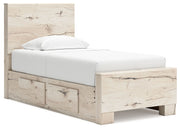 Signature Design by Ashley Lawroy panel bed with built-in storage drawers in a modern bedroom setting.