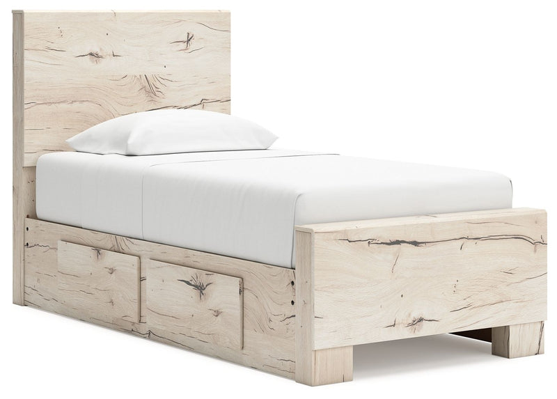 Signature Design by Ashley Lawroy panel bed with built-in storage drawers in a modern bedroom setting.