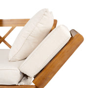 Noble House outdoor patio daybed sofa with three seats, foldable arms, and four back pillows on a patio setting