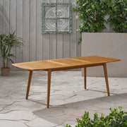 Outdoor expandable dining table by Noble House with slatted tabletop and tapered legs, perfect for patio or garden dining.
