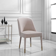 Set of two Uttermost Brie armless chairs with beige upholstery and wooden legs, modern design perfect for living room or lounge.